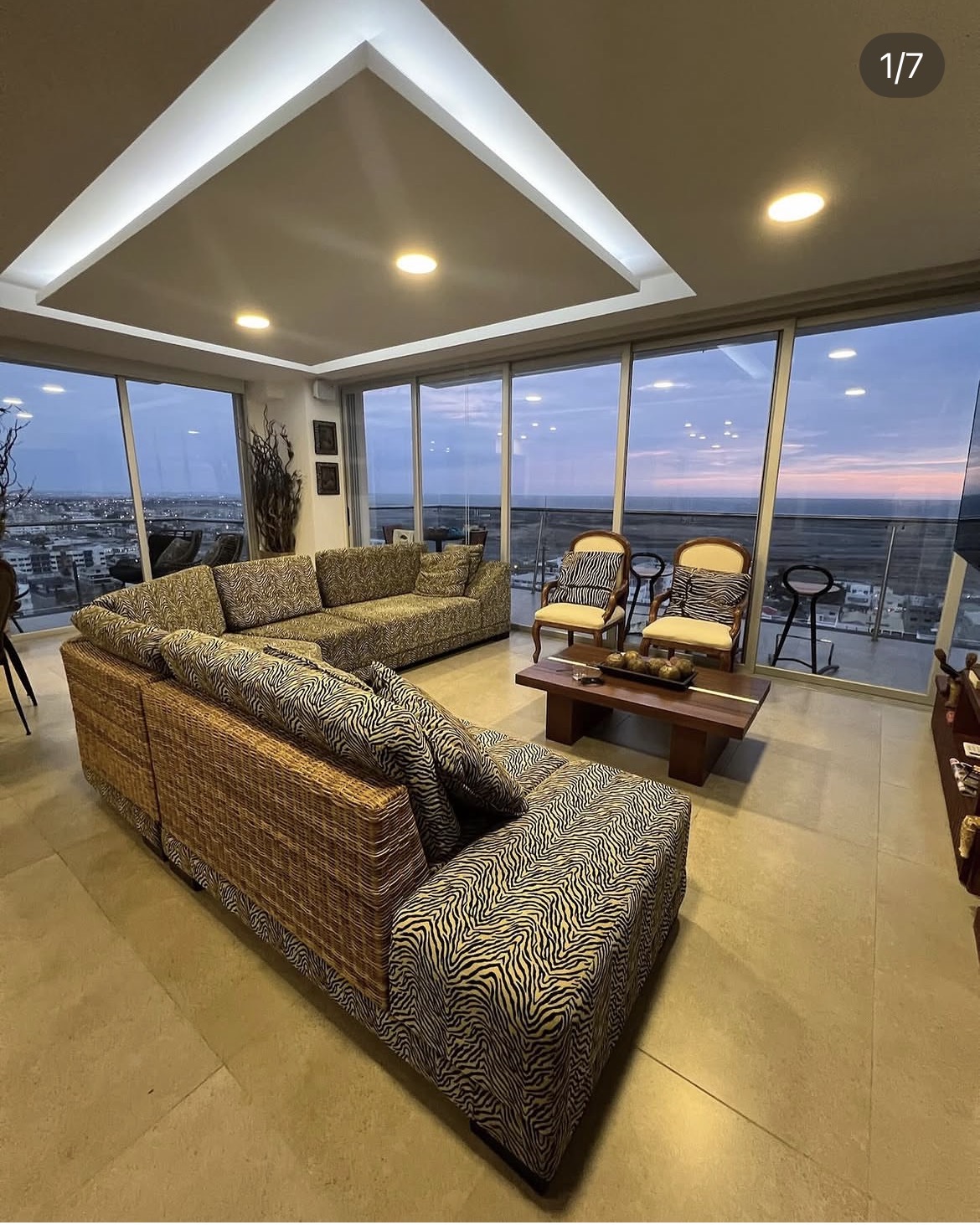 Tiendablau post, living room with zebra-print sofa, shot in a client's home